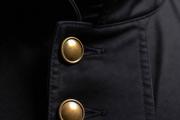 Brass buttons on chimney sweep coat — good luck charm