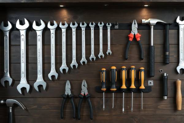 Chimney sweep tools organized on wall